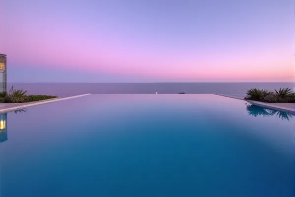 A clear reflection of a modern structure appears on a transparent surface, representing a state of perfect liquid equilibrium and clarity.